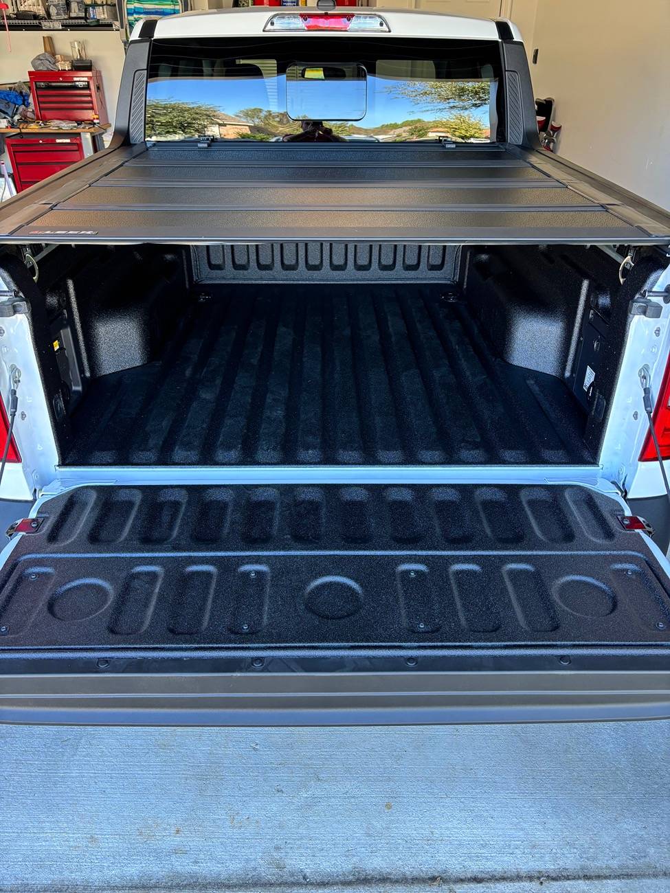 LEER HF650M quad-fold hard tonneau cover installed on a Ford Maverick